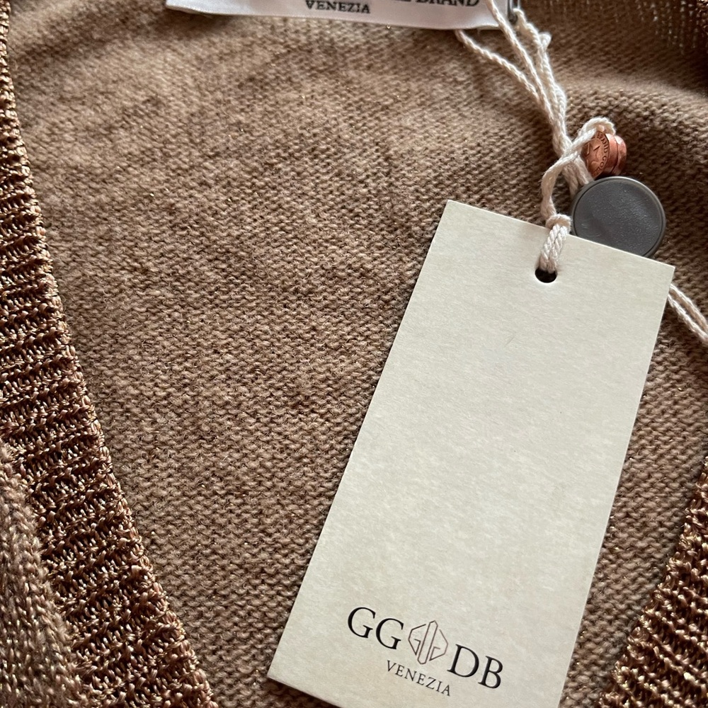 Very pretty gold with glitter threads. Youth size